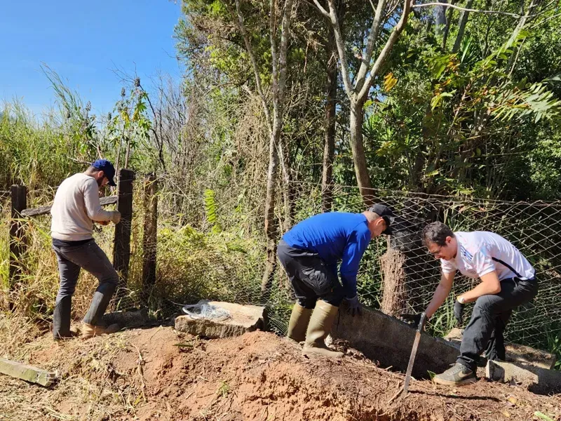 Members working on the Monastery fence on a hands-on day