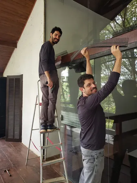 Member repairing a staircase on a hands-on day