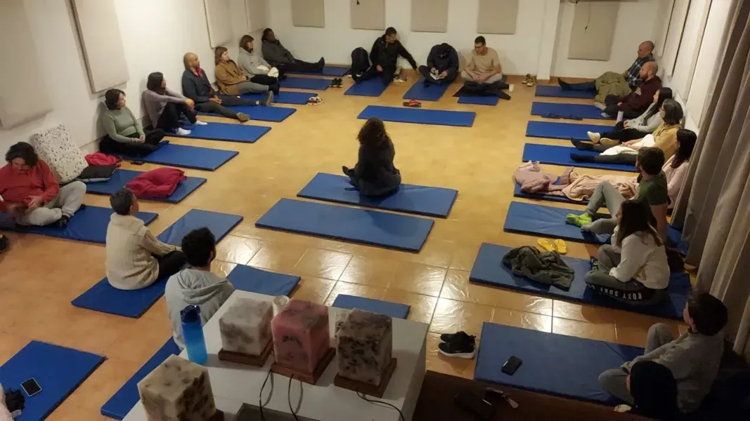 Members' activity on mats in the Monastery hall